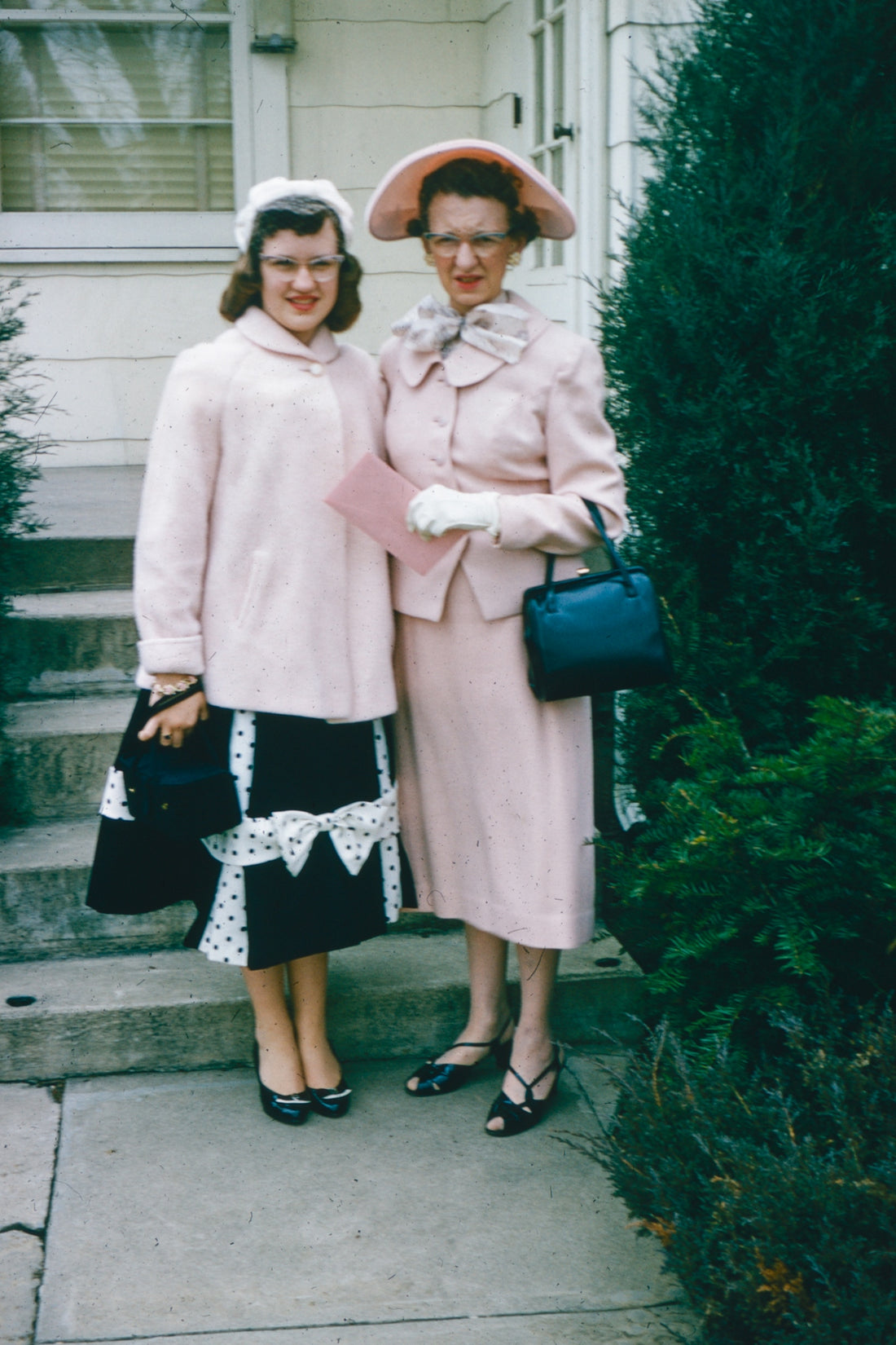 a couple of women standing next to each other
