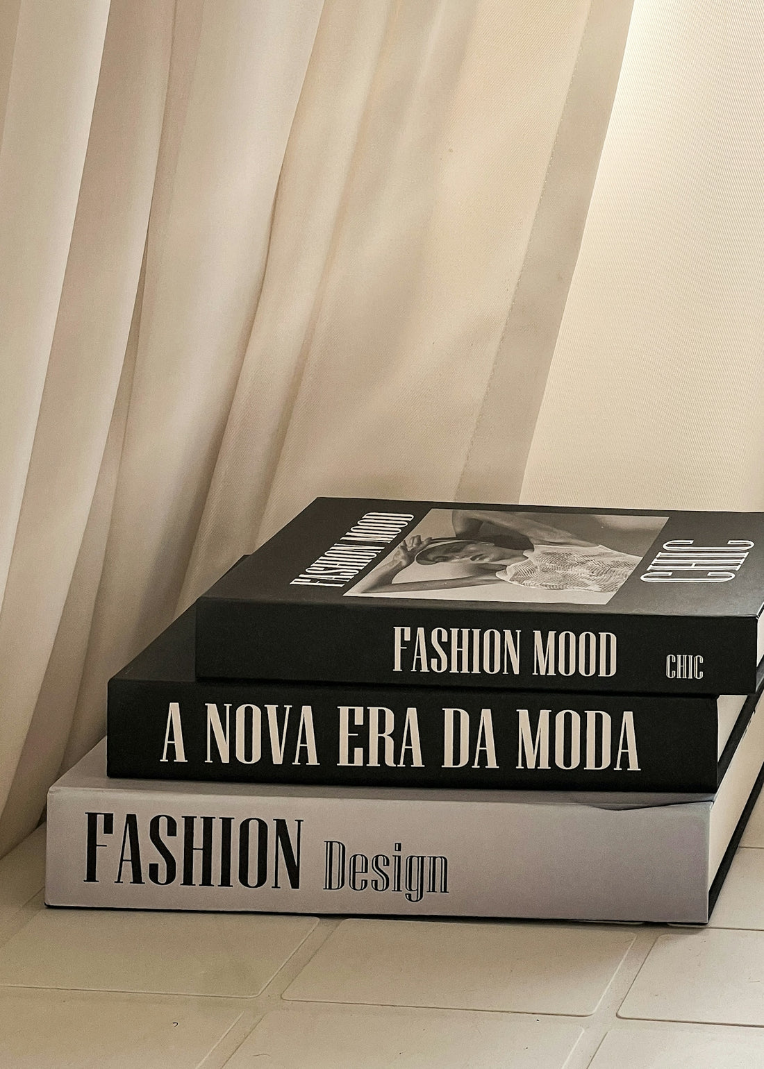 a stack of three books sitting on top of each other